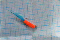 стример Сахалинский универсальный №6  тело синель вапси шерсть ярко оранжевая+  голубой УФ  хвостик из песца Юмер